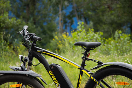 Ukraine Dnipro 27.06.2021 - electric bike in the park during the day for a walk, city electric...