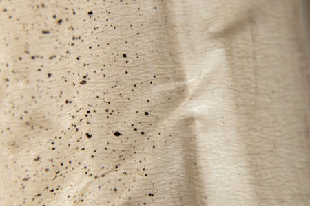 brown paper with spots of paint for the background, splashes of paint on paper as a background, watercolorの写真素材
