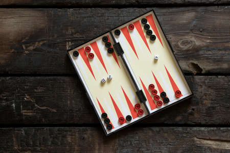 backgammon lie on an old wooden table, backgammon gameの写真素材