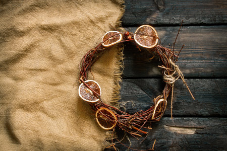 new year christmas wreath on an old wooden table, decor for the holiday, dry vine wreathの写真素材