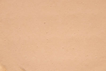 powder as background, macro photo of powder, beige backgroundの写真素材