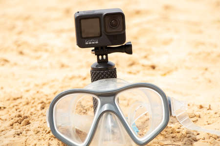Ukraine Dnipro 08/05/2021 - GoPro HERO 9 camera and mask for diving on the beach, action camera on the seaのeditorial素材