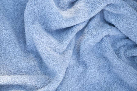 crumpled terry towel as background, blue backgroundの写真素材