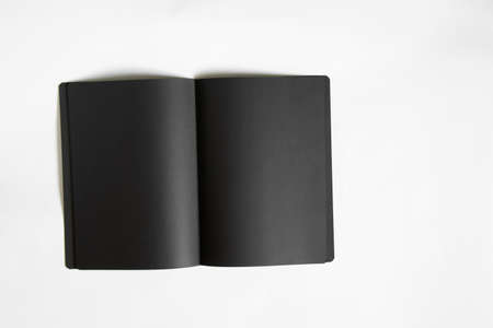 black blank blank open notebook on white background, notebook with black pages on whiteの写真素材
