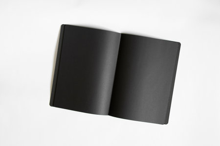 black blank blank open notebook on white background, notebook with black pages on whiteの写真素材