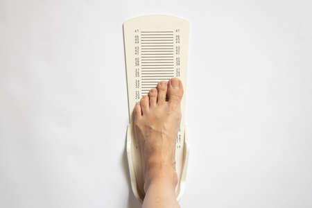 stopwatch for measuring leg length on an isolated background, plastic leg length meterの写真素材