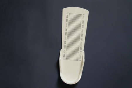 stopwatch for measuring leg length on an isolated background, plastic leg length meterの写真素材