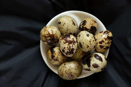quail eggs close-up on a black background, quail eggs macro photoの写真素材