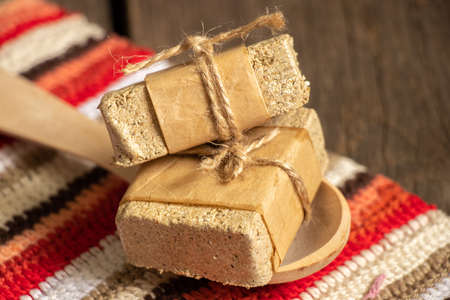 a piece of peanut halva on the table for breakfast, halva on the tableの写真素材