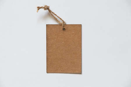 brown paper blank price tag on rope on isolated background, price tagの写真素材