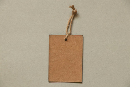 brown paper blank price tag on rope on isolated background, price tagの写真素材