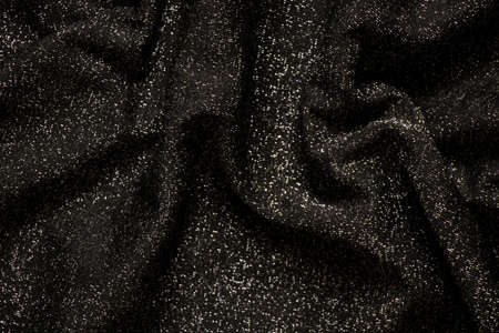 black and gray fabric with sequins as background, wrinkled fabric for background, evening dress with glitter, black backgroundの写真素材
