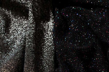 black and gray fabric with sequins as background, wrinkled fabric for background, evening dress with glitter, black backgroundの写真素材