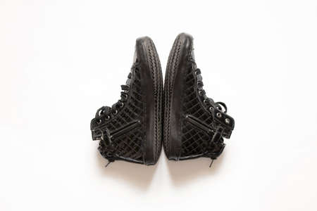 black patent women's shoes torn lies on a white isolated background, women's shoesの写真素材