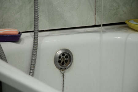 an old bathroom in a Soviet apartment without renovation, a bathroom with old renovations, a bathroomの写真素材