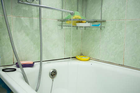 an old bathroom in a Soviet apartment without renovation, a bathroom with old renovations, a bathroomの写真素材