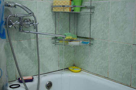 an old bathroom in a Soviet apartment without renovation, a bathroom with old renovations, a bathroomの写真素材