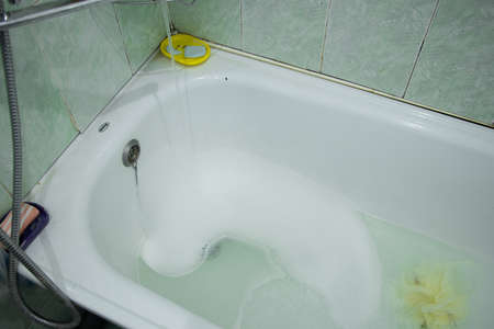 an old bathroom in a Soviet apartment without renovation, a bathroom with old renovations, a bathroomの写真素材