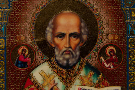 Ukraine Dnipro 08/22/2021 - icon of St. Nicholas, close up of a prayer book, Christian icon, church religionのeditorial素材