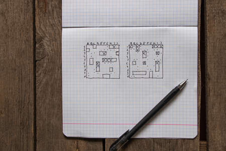 sea battle game, hand-drawn with a pen in a white notebook, rest on a break, school game, child's...