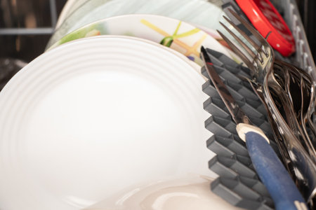 dishwasher with clean dishes at home in the kitchen, washing dishes, clean plates from the dishwasherの写真素材