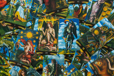 Ukraine Dnipro 08/25/2021 - Divination tarot cards on the table as a background, divination by tarot...