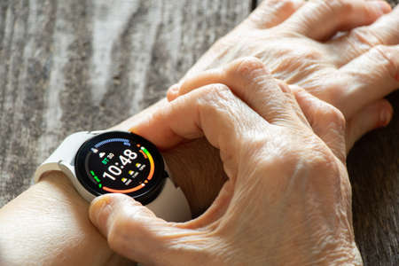 Ukraine Dnipro 11/30/2021 - Smart watch Samsung Galaxy Watch 4.40 mm on a woman's hand, new watch, smart watch, watch on her handのeditorial素材