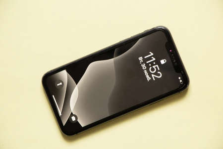Ukraine Dnipro 11/30/2021 - Smartphone Apple iPhone 11 on an isolated background, old phoneのeditorial素材