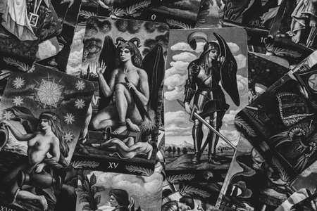 Ukraine Dnipro 08/25/2021 - Divination tarot cards on the table as a background, divination by tarot cards, magic and witchcraftのeditorial素材