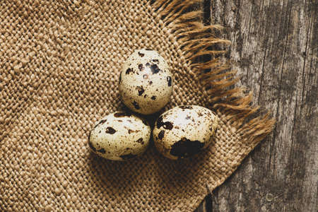 quail eggs close-up on a wooden table on a tablecloth, quail eggs macro photo