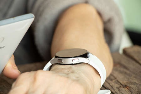 Ukraine Dnipro 11/30/2021 - Smart watch Samsung Galaxy Watch 4.40 mm on a woman's hand, technology,...