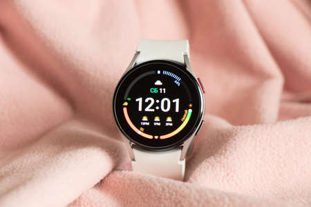 Ukraine Dnepr 11.12.2021 - Smart watch Samsung Galaxy Watch 4 track with a gray strap on an isolated...