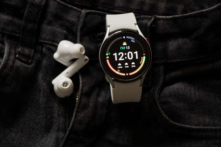 Ukraine Dnipro 11/30/2021 - Smart watch Samsung Galaxy Watch 4.40 mm and mobile phone with app for...