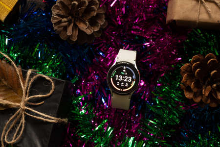 Ukraine Dnipro 11/30/2021 - Smart watch Samsung Galaxy Watch 4.40 mm and mobile phone with app for watch, phone and watchのeditorial素材