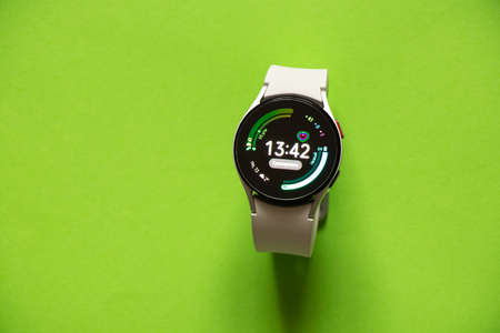 Ukraine Dnipro 11/30/2021 - Smart watch Samsung Galaxy Watch 4.40 mm and mobile phone with app for watch, phone and watchのeditorial素材