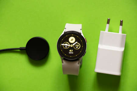 Ukraine Dnipro 11/30/2021 - Smart watch Samsung Galaxy Watch 4.40 mm and mobile phone with app for...