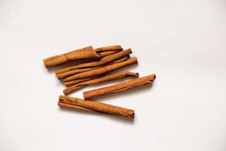 cinnamon lies on a white background, cinnamon close-up
