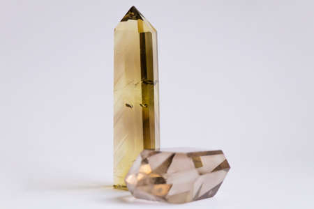 two natural quartz crystals on a white background