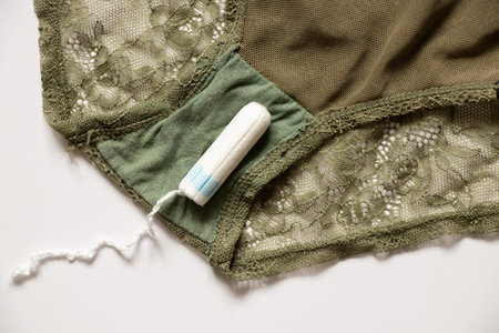 white tampon lies on women's panties, hygiene product on menstrual days, tampon, menstrualの写真素材