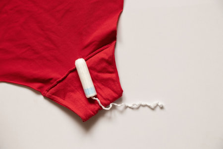 white tampon lies on women's panties, hygiene product on menstrual days, tampon, menstrualの写真素材