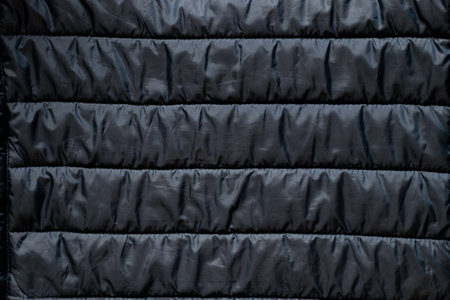 blue down fabric of a winter men's jacket as a background, blue fabric, a winter jacket as a background, outerwear, jacketの写真素材