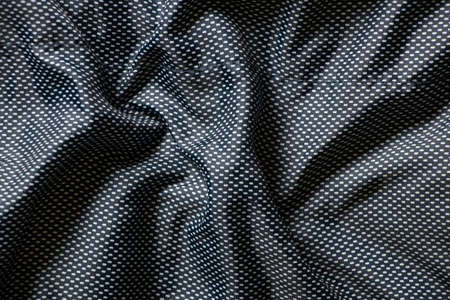 polyester blue fabric in small dot as background, blue wrinkled fabric for background, texture and...