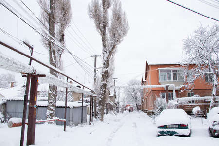 Ukraine Dnipro 26.12.2021 - City in winter with cars in the snow and people trying to get to the robot in the morning after snowfall, winter in the cityのeditorial素材