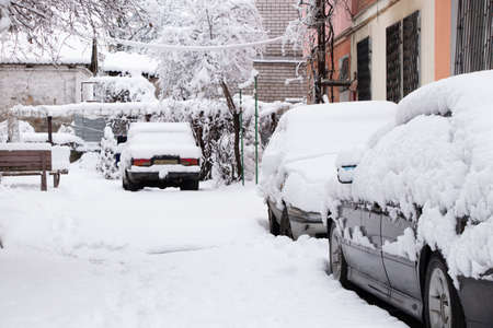 Ukraine Dnipro 26.12.2021 - City in winter with cars in the snow and people trying to get to the robot in the morning after snowfall, winter in the cityのeditorial素材