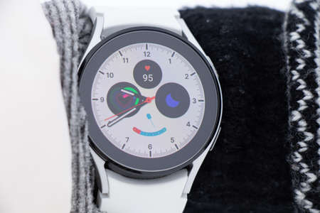 Ukraine Dnipro 26.12.2021 - Smart watch Samsung Galaxy 4.40 mm on a girl's hand in winter on the...