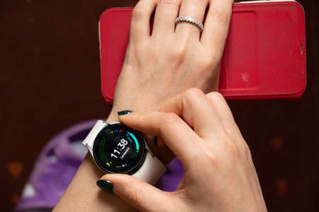 Ukraine Dnepr 06.01.2021 - Smart watch Samsung Galaxy 4.40 mm and a mobile phone with an application...