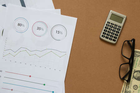 reports and histograms on paper on the table, analytics and statistics on paper, business analytics