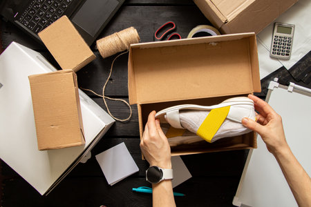 Women's online store, small business owner, entrepreneur, packing bag, mailbox preparing parcel on the table for shipping. Dropshipping delivery concept in e-commerce.Product packagingの写真素材