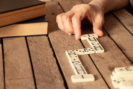 female old hand playing dominoes,gambling and hobbyの写真素材
