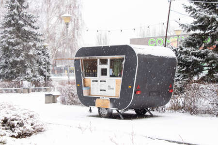 02.03.2022 Ukraine Dnipro - Coffee trailer to the parks in the winter afternoon, coffee to go, small businessの写真素材